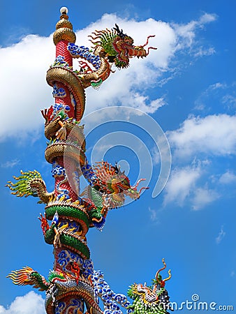 Chinese dragon statue climbing pole Stock Photo