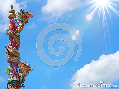 Chinese dragon statue climbing pole Stock Photo