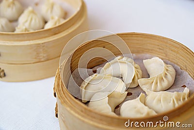 Chinese dumplings in bamboo steamer. Dumplings are among the mos Stock Photo