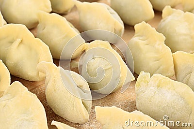 These Chinese dumplings jiaozi are traditionally eaten during Chinese New Year. Stock Photo