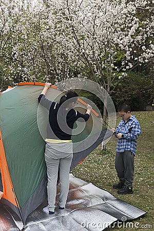 Family pitch a tent Stock Photo