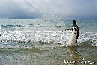 Chinese fisherman pulls the chain out of the sea Editorial Stock Photo
