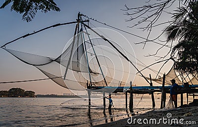 Chinese fishing nets during the Golden Hours at Fort Kochi, Kerala, India sunrise fisherman work Editorial Stock Photo