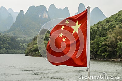 Chinese flag over the Li-River or Li Jiang, China Stock Photo