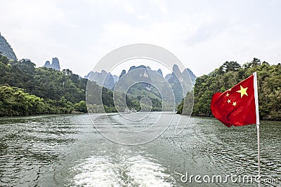 Chinese flag over the Li-River or Li Jiang, China Stock Photo