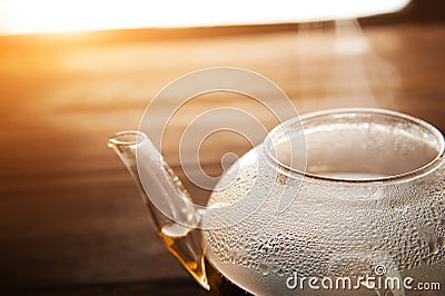 Chinese flower bound tea in a transparent teapot with condensation and steam. Concept of tea ceremony with the disclosure of tea i Stock Photo