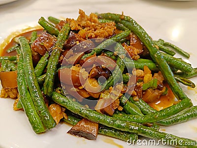 Chinese Food long bean with mushroom cooked with oyster sauce on white plate, oriental Stir Fry Food Stock Photo