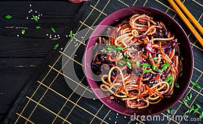 Chinese food. Vegan stir fry noodles with red cabbage and carrot Stock Photo