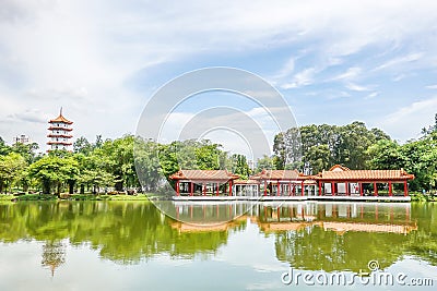 Chinese Garden with 7-storey pagoda,Traditional Chinese pavilion and sheltered walkway beside a lake, Singapore Stock Photo