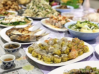 Chinese Ghost Festival. Sacrificial offering food for pray to god and memorial to ancestor Stock Photo
