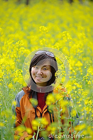 Chinese girl in cole flowers Stock Photo