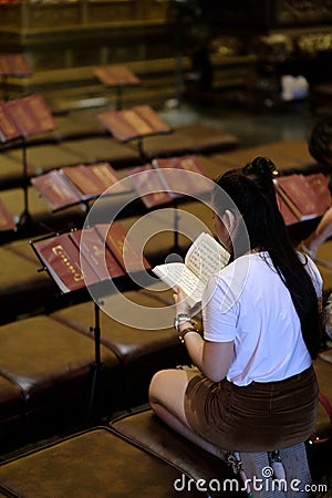 Chinese girl reading Editorial Stock Photo