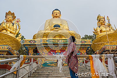 Chinese girl standing near statues at the temple Editorial Stock Photo
