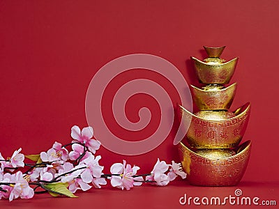Chinese gold ingot on red background Stock Photo