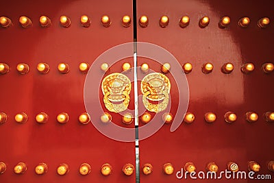 Chinese golden lion on red door Stock Photo