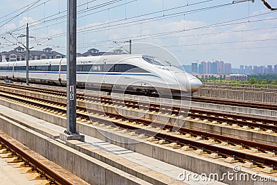 Chinese high speed train passing by Editorial Stock Photo