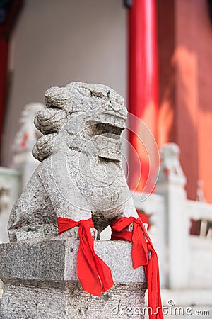 Chinese Imperial Lion, Guardian Lion with a red fabric in their Stock Photo