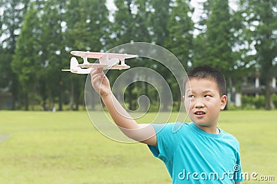 Chinese kid holding model plane ready for fly Stock Photo