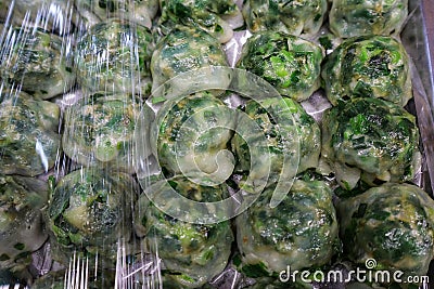 Chinese Kuicheai pastry. The dough is made from rice flour mixed with tapioca flour. The filling is made from green chives. Stock Photo