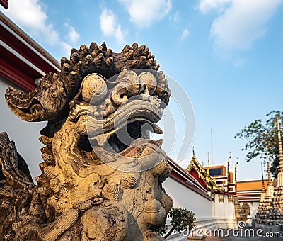 Chinese Lion Statue stand Wat Pho Landmark Bangkok Thailand Stock Photo