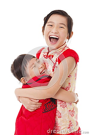 chinese little Girls and Giving One Another Hug Stock Photo