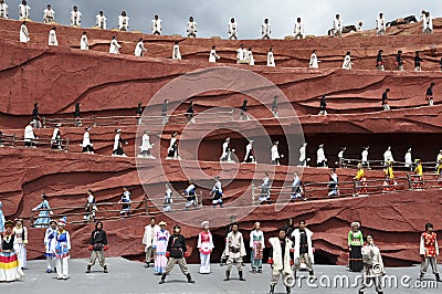 Chinese minority actors in the outdoor theater per Editorial Stock Photo
