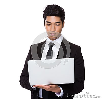 Chinese mixed Indian businessman use of the laptop computer Stock Photo