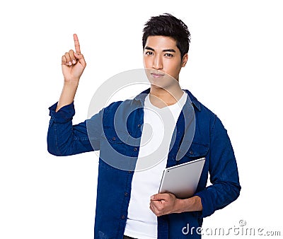 Chinese mixed iranian man hold with tablet and finger point up Stock Photo