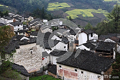 Chinese mountain village with rapeseed flower blossom Stock Photo