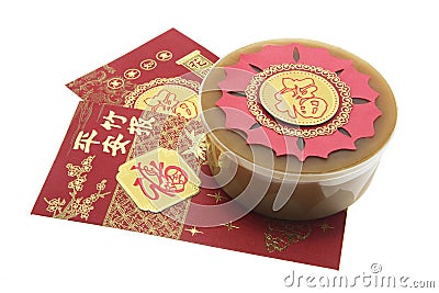 Chinese New Year Cake and Red Packets Stock Photo
