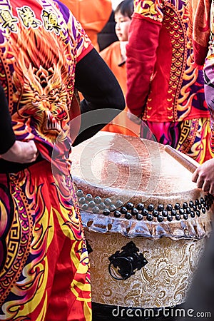 Chinese New Year parade in Usera neighborhood, Madrid. Spain. Close-up of a ceremonial drum carried by participants dressed in Editorial Stock Photo