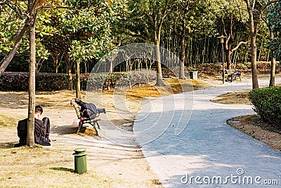 Chinese office workers resting in a park Editorial Stock Photo