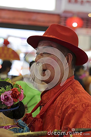 Chinese old farmer in the holiday Editorial Stock Photo