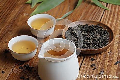 Chinese oolong tea, tea leaves and white cups Stock Photo