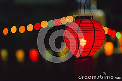 Lamp Red color hanging at Night Stock Photo