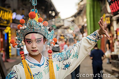 Chinese person in folk costume in Ci Qi Kou Ancient town in Chongqing Editorial Stock Photo