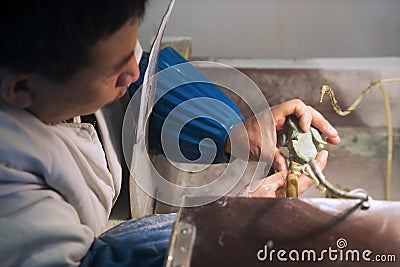 Chinese person makes engraving jade Editorial Stock Photo