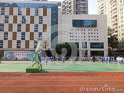 Chinese primary school students in the school playground Physical Education Editorial Stock Photo