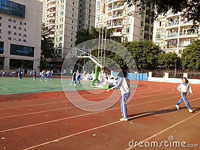 Chinese primary school students in the school playground Physical Education Editorial Stock Photo