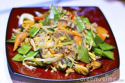 Chinese Seafood Fried Noodle in A Plate. Stock Photo