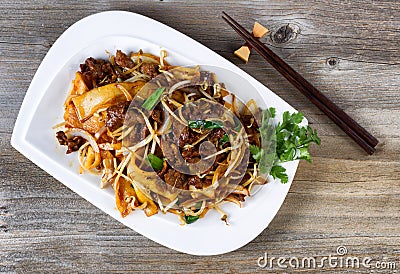 Chinese spicy beef dish in plate setting ready to eat Stock Photo