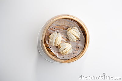 Chinese steamed buns Baozi in basket isolated on white background Stock Photo