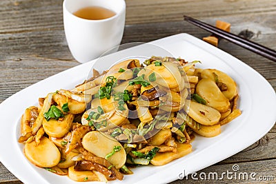 Chinese stir fry sticky rice slices and vegetable dish ready to Stock Photo