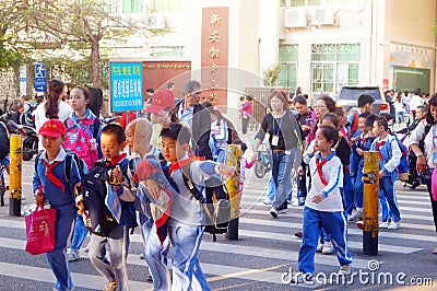 Chinese students home after school through traffic intersection Editorial Stock Photo