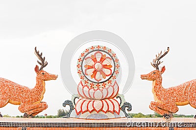 Chinese-style deer and Dharma Chakra statues Stock Photo