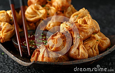 Chinese takeaway finger food Vegetable wontons with sweet chilli dip sauce and chop sticks Stock Photo