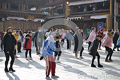 Chinese Tibetan girls dancing in old town Shangri La, Xianggelila, Yunnan, China Editorial Stock Photo