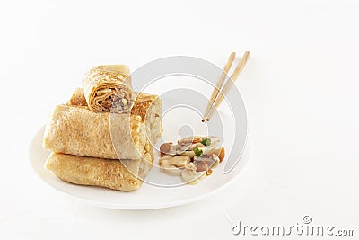 Chinese tortillas - bings in plate with mushrooms on a white background. Stock Photo