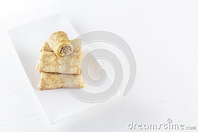 Chinese tortillas - bings in plate on a white background. Stock Photo