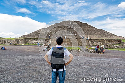 A Chinese tourist looking at the largest ruins of the architecturally significant Mesoamerican pyramids in Teotihuacan, an Editorial Stock Photo